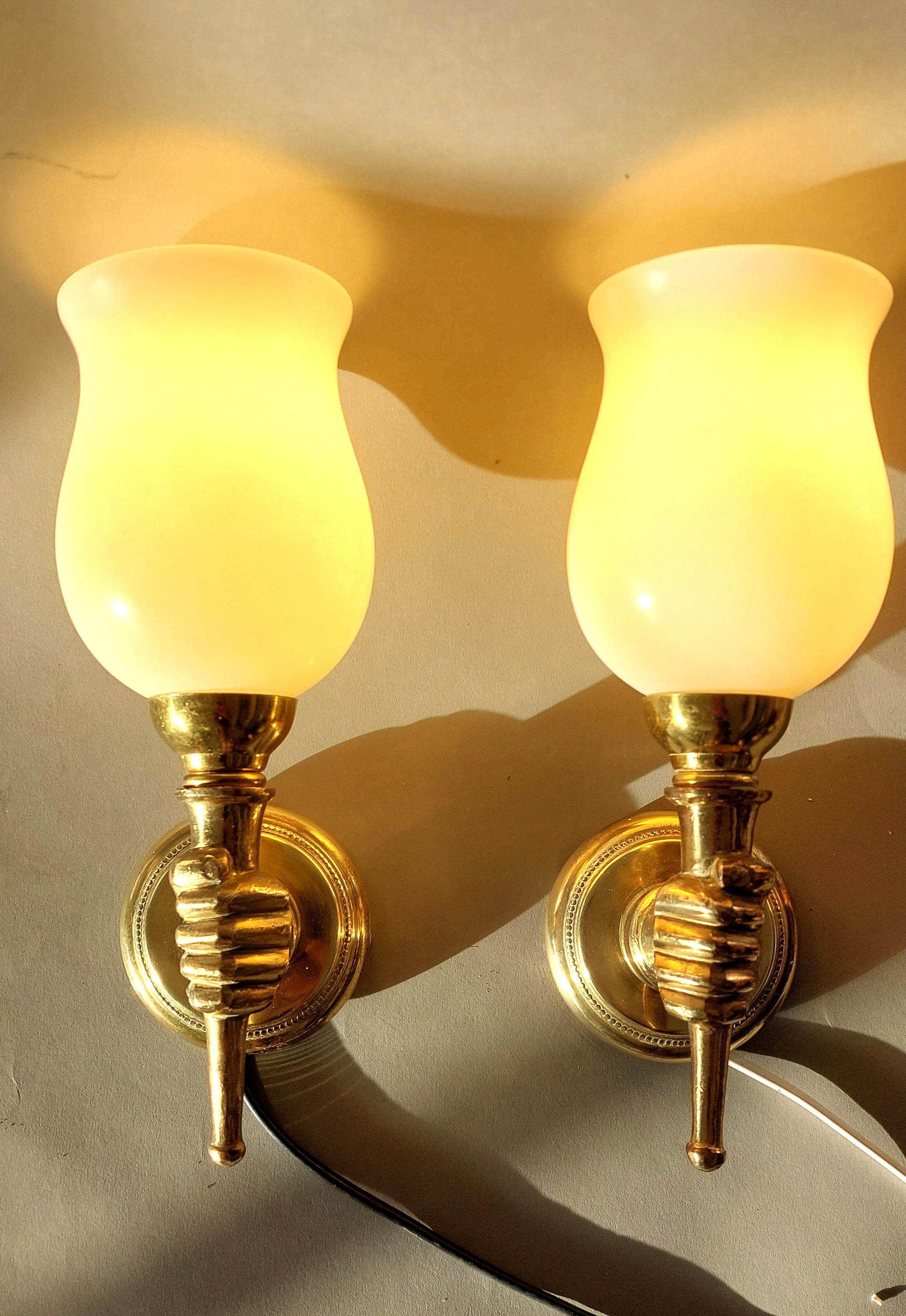 Pair of bronze and gilded brass sconces by John Devoluy 1950.