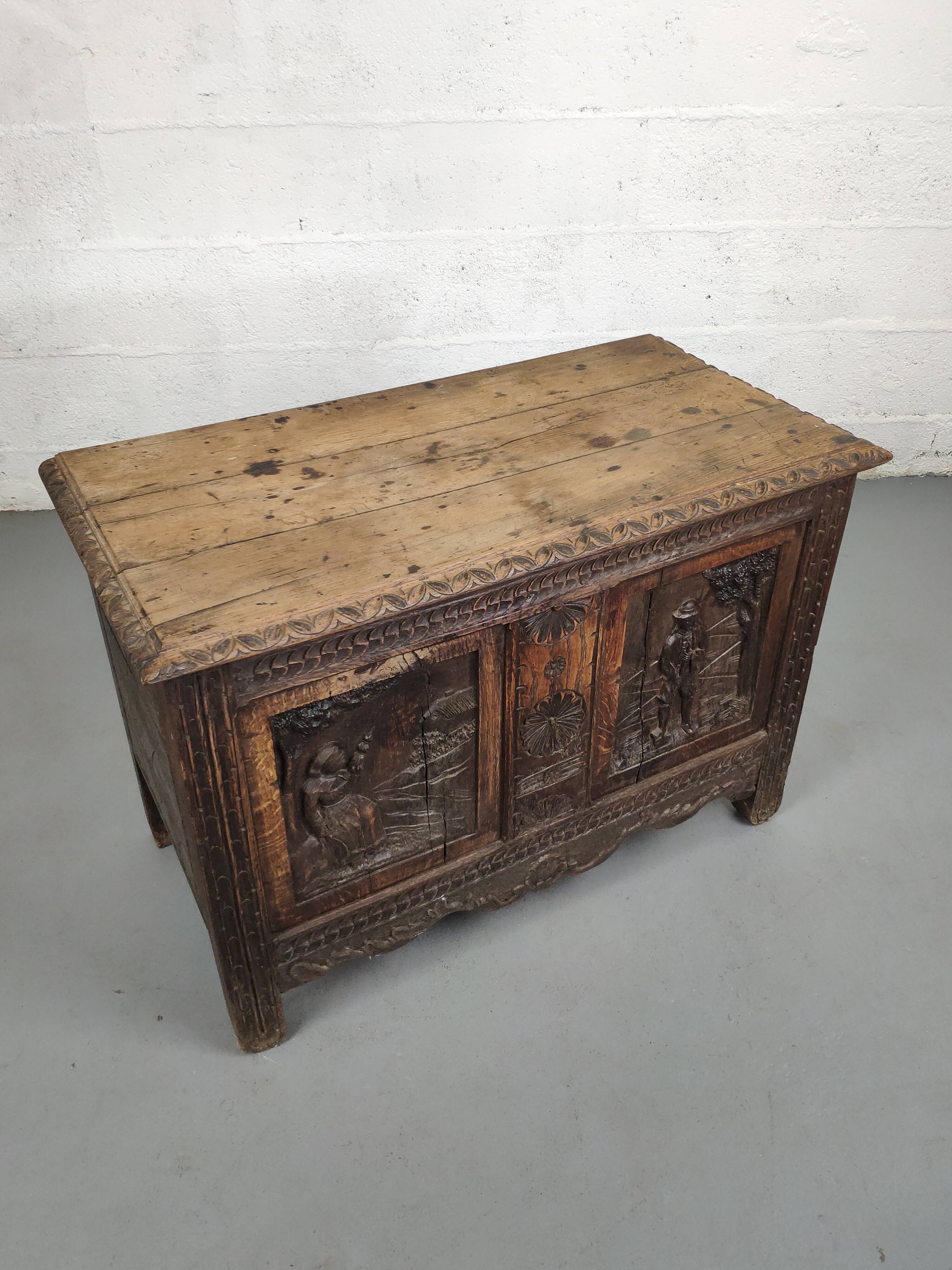 Old storage chest oak carved traditional scene
