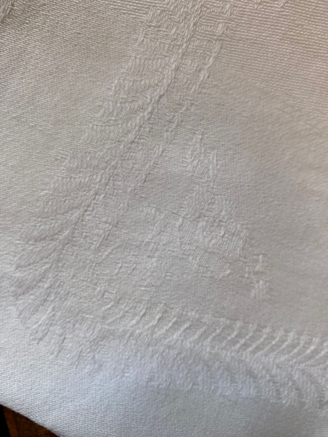 Pair of embroidered white cotton tea towels.