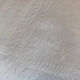 Pair of embroidered white cotton tea towels.