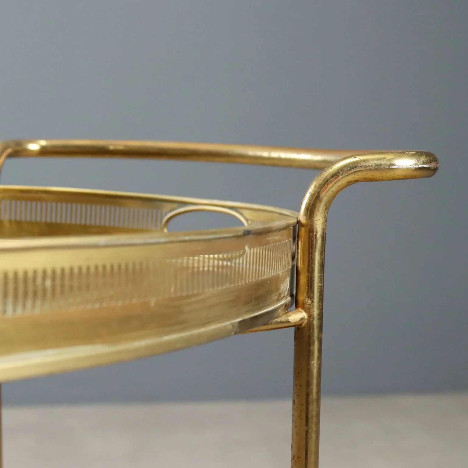 Vintage double-tier brass serving trolley, 1950s design.