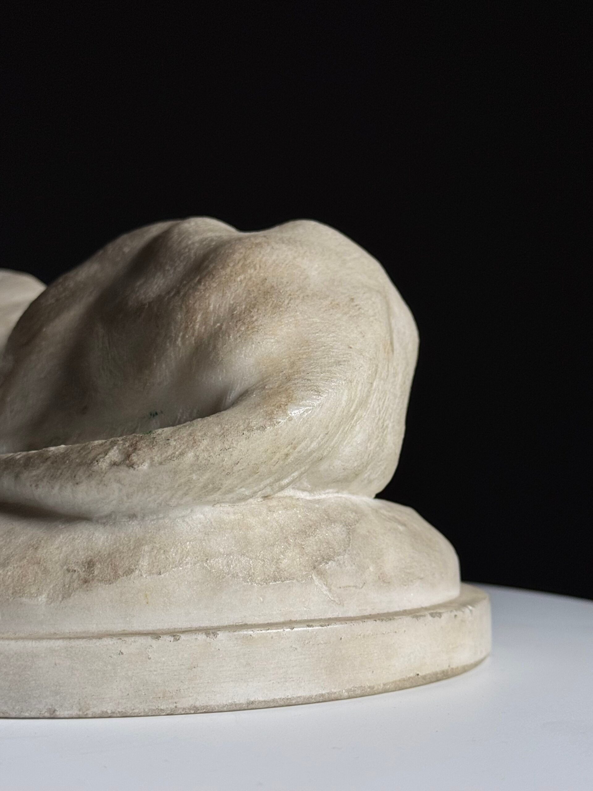 Marble sculpture of a reclining lion