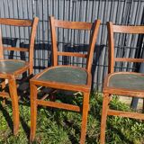 Set of four wooden bistro chairs, green seat, mid-20th century.