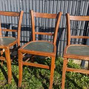 Set of four wooden bistro chairs, green seat, mid-20th century.
