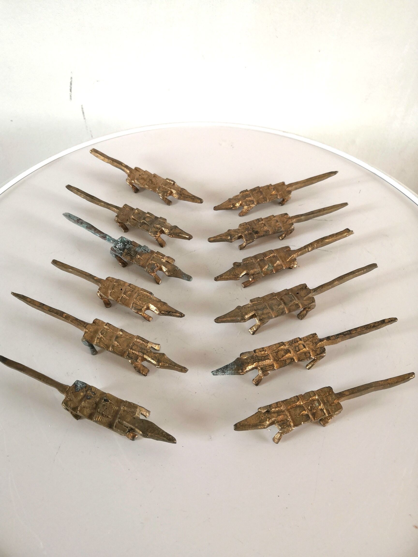 12 vintage bronze knife rests