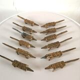 12 vintage bronze knife rests