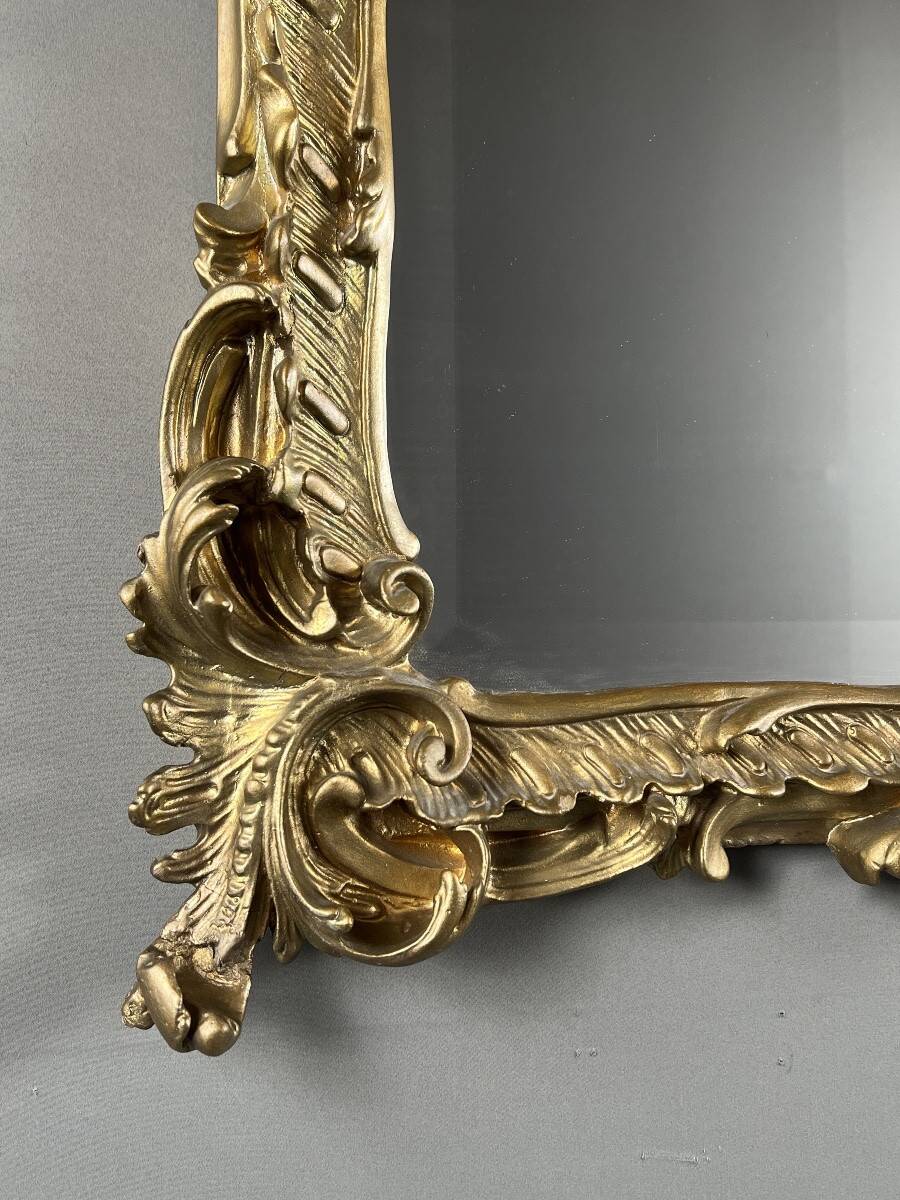 Large gilded wooden mirror in Louis XV style, 19th century.