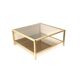 Large vintage Hollywood Regency coffee table made of brass and smoked glass from the 1970s