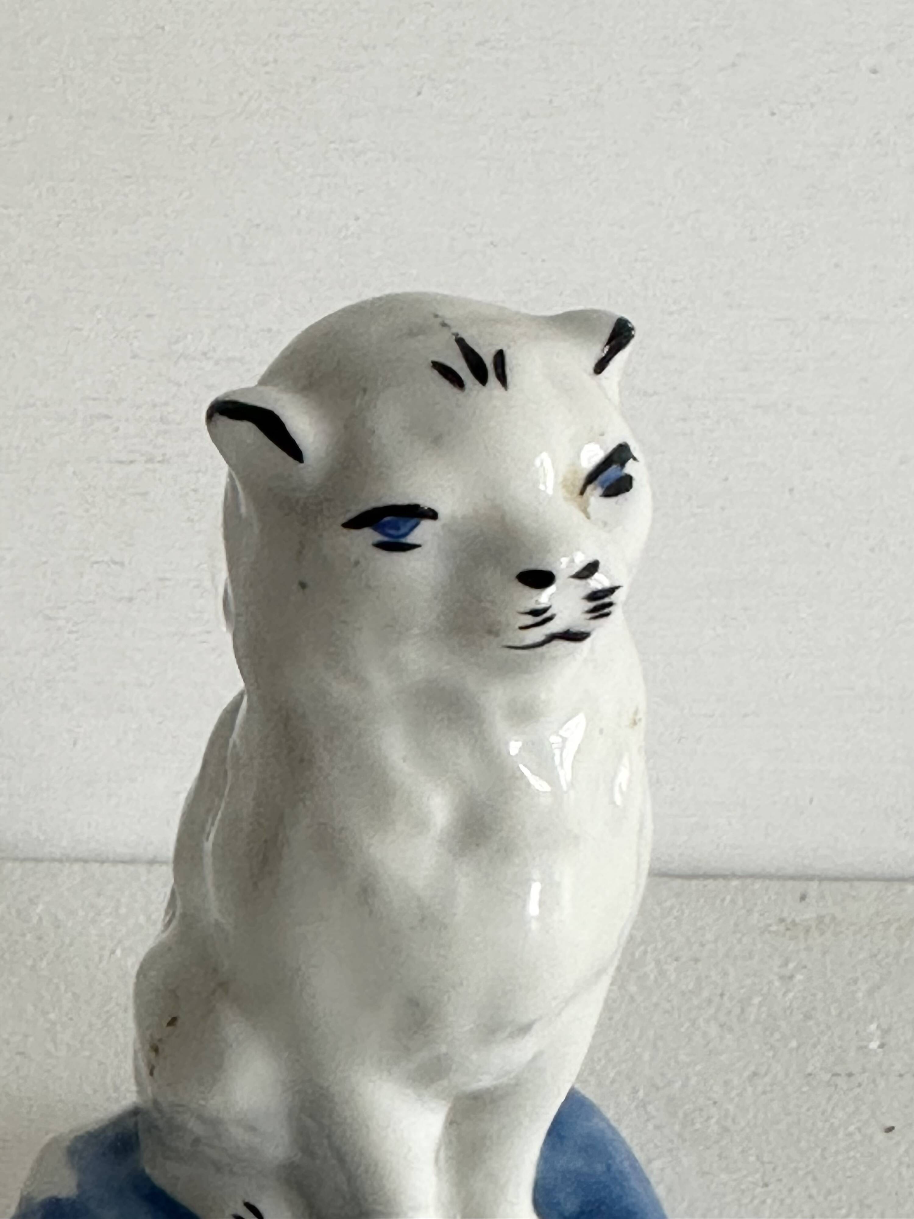 Small ancient glazed ceramic cat from the 19th century.