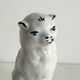 Small ancient glazed ceramic cat from the 19th century.