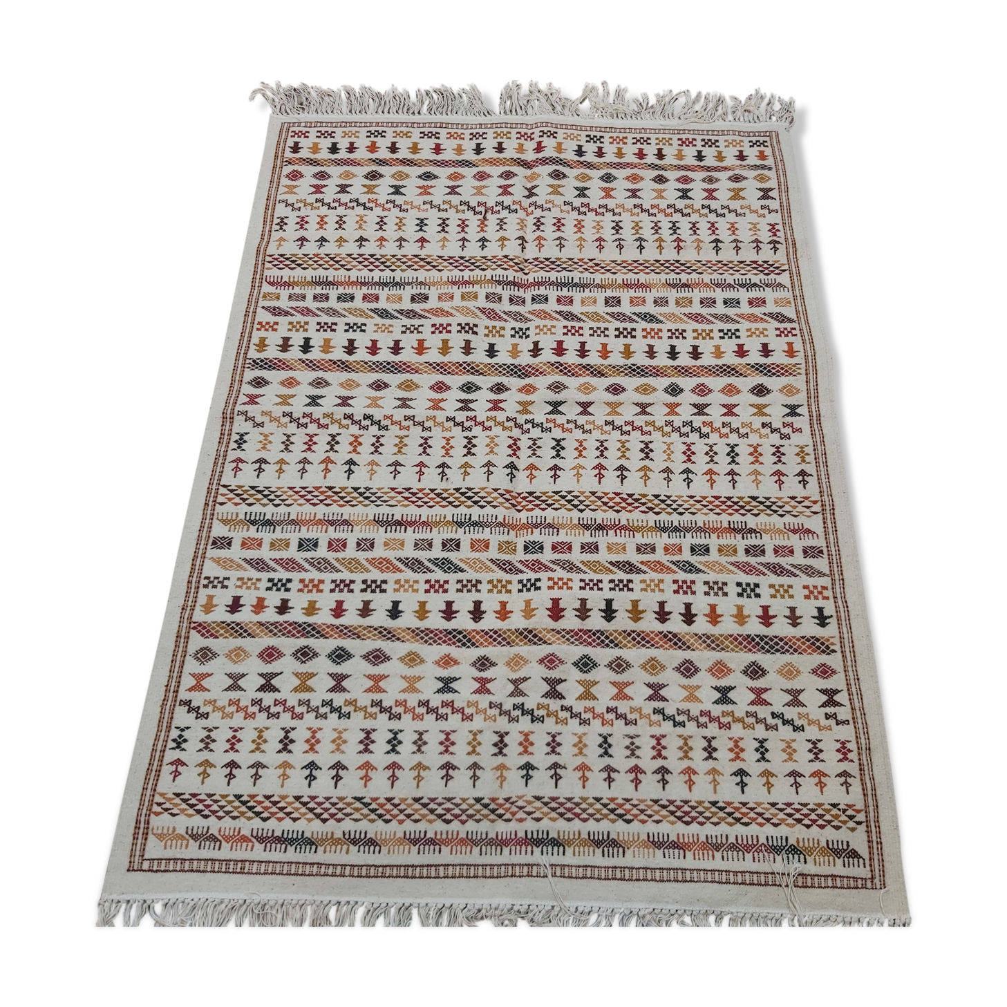 White carpet with multicolored Berber patterns