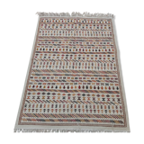 White carpet with multicolored Berber patterns