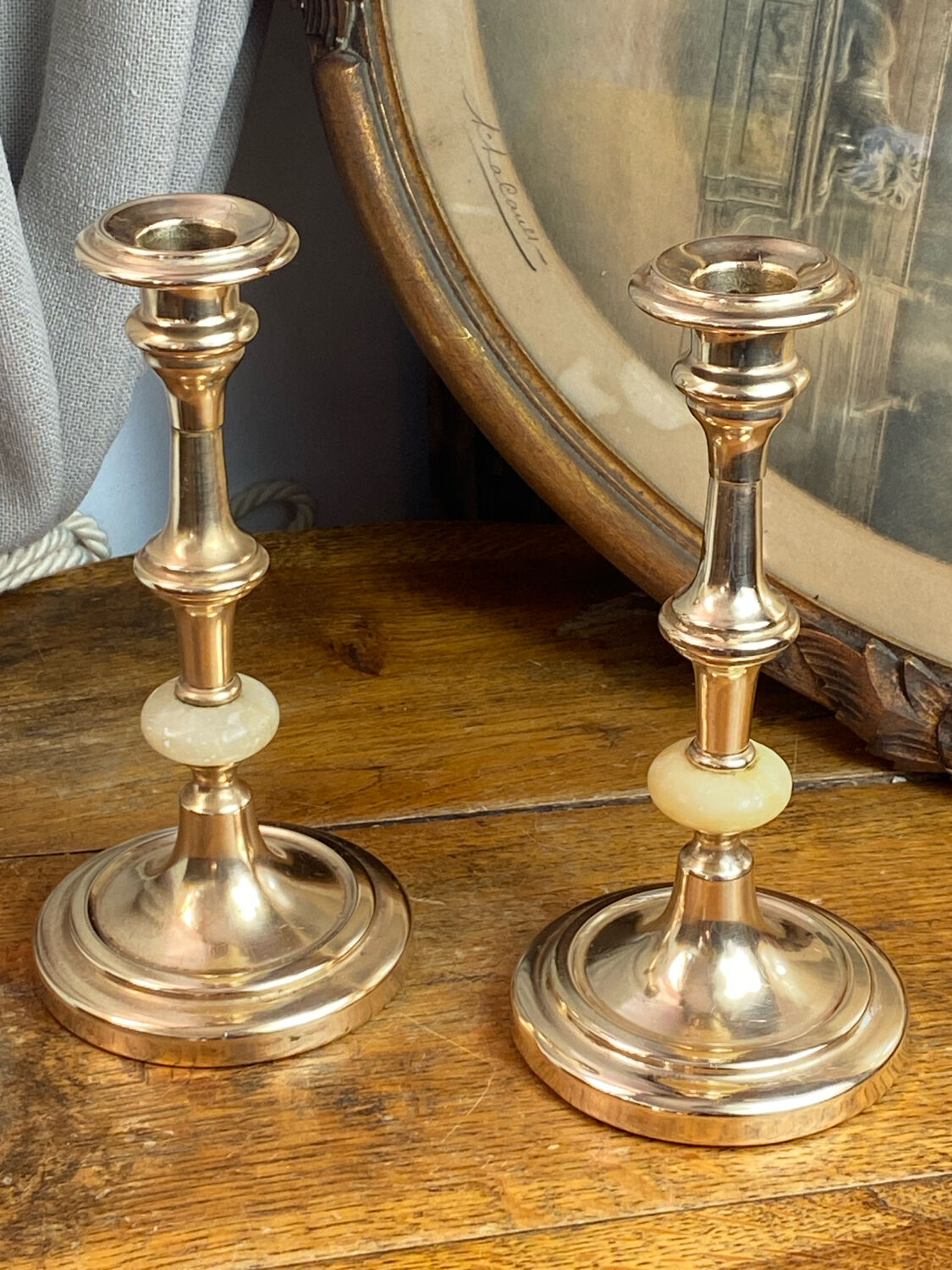 Pair of brass and stone candlesticks
