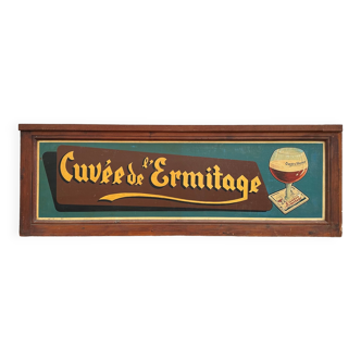 Old advertisement "Cuvée de l'Ermitage" painted on wood