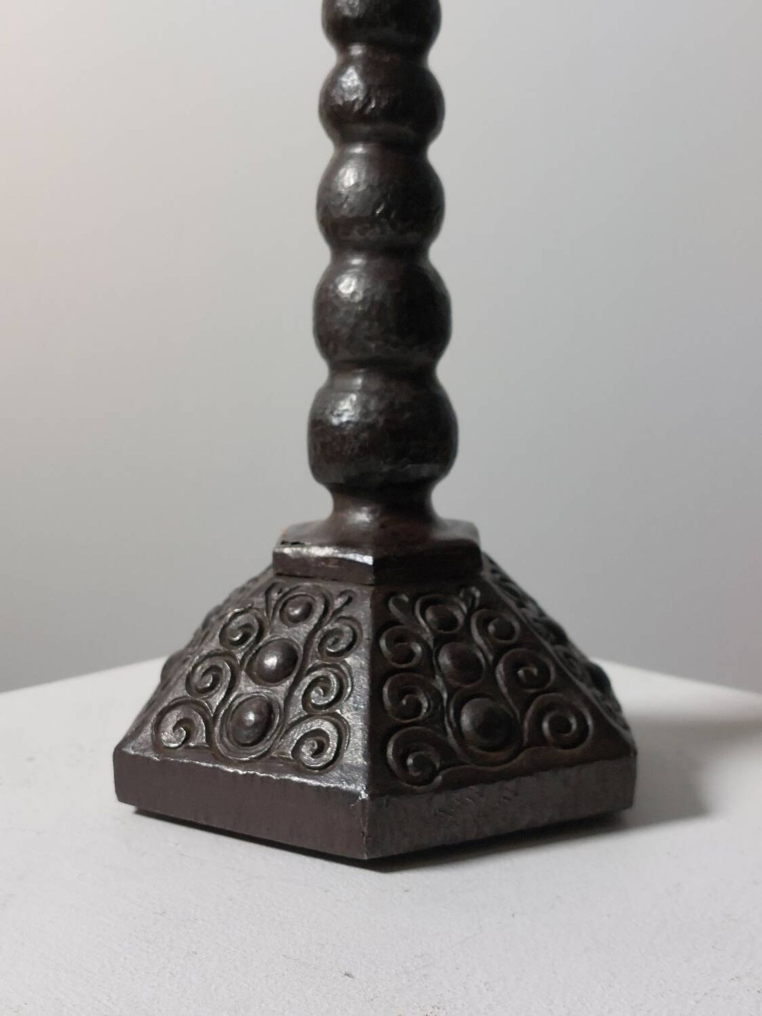 Candelabrum in the shape of a spool, skilfully forged in menorah style.
