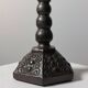 Candelabrum in the shape of a spool, skilfully forged in menorah style.