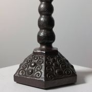 Candelabrum in the shape of a spool, skilfully forged in menorah style.
