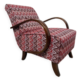 C-shaped lounge chair by J. Halabala