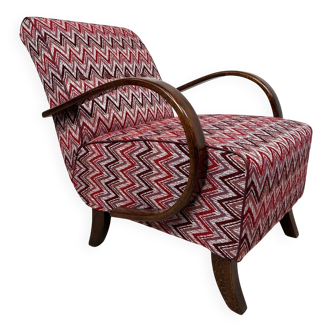 C-shaped lounge chair by J. Halabala