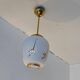 Pair of opaline globe pendant lights with stylized decoration, 1950s