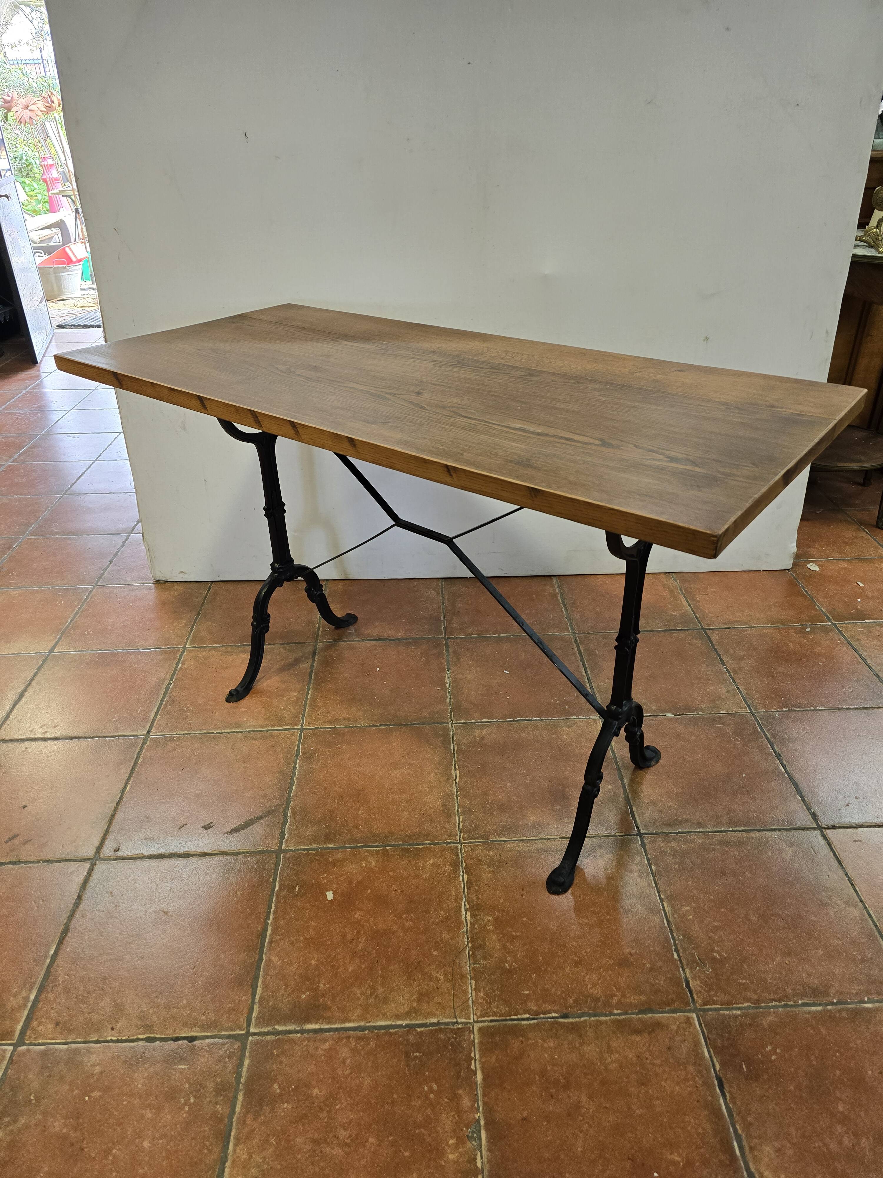 Old bistro table with oak top, cast iron base, 118 cm L