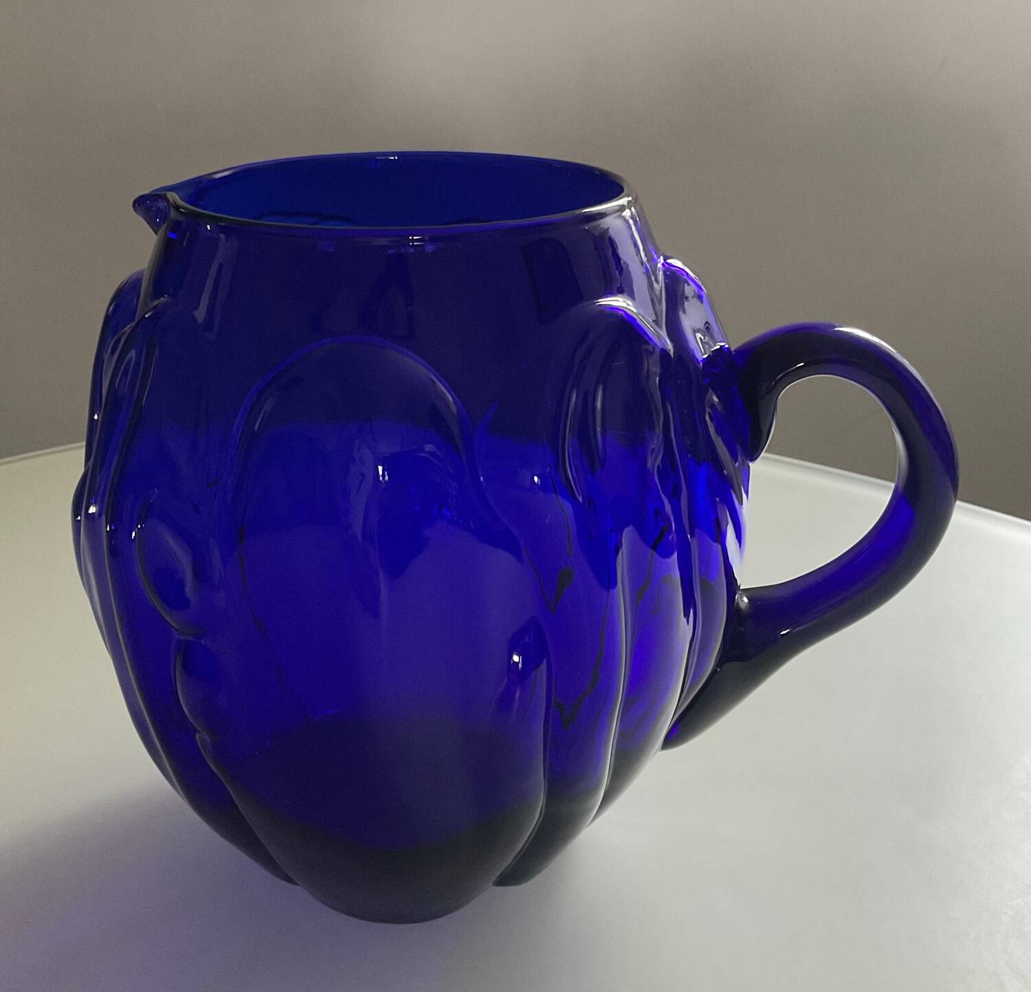 Vintage cobalt blue glass pitcher by Henry Dean