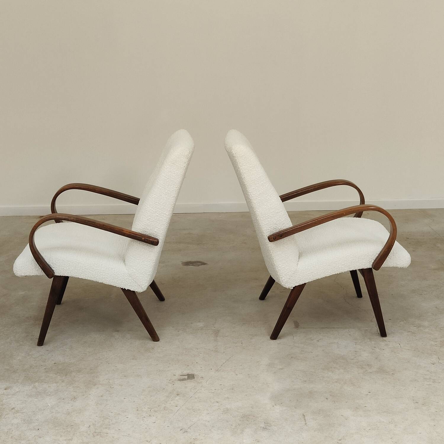 Pair of Jaroslav Smidek armchairs for Ton Bystrice, restored with white boucle, 1960.
