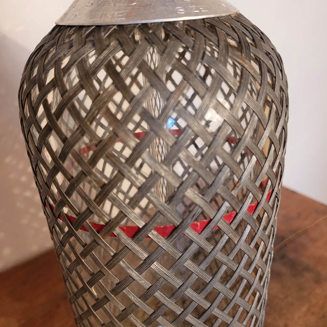 Old glass and metal siphon