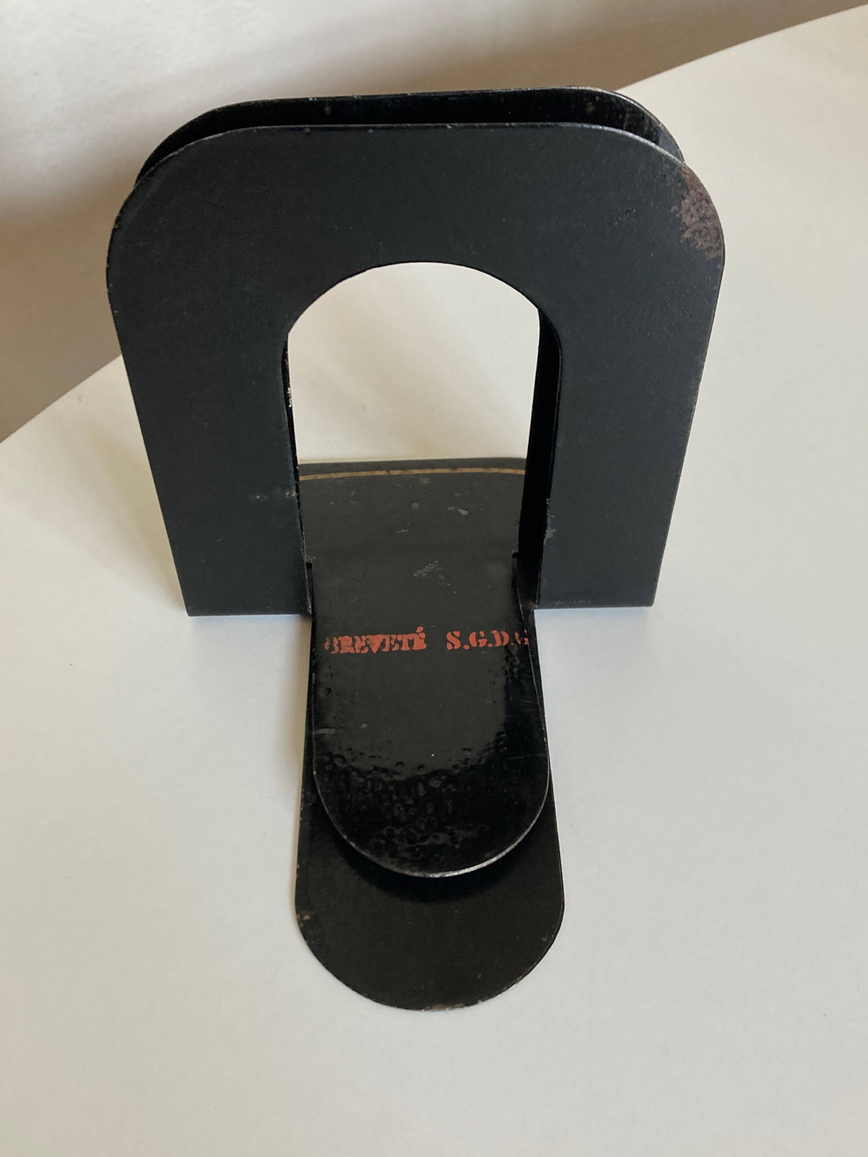 Pair of heavy metal bookends, folded, 1920.