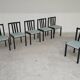 Set of 6 modernist black chairs with light blue-green ribbed fabric.