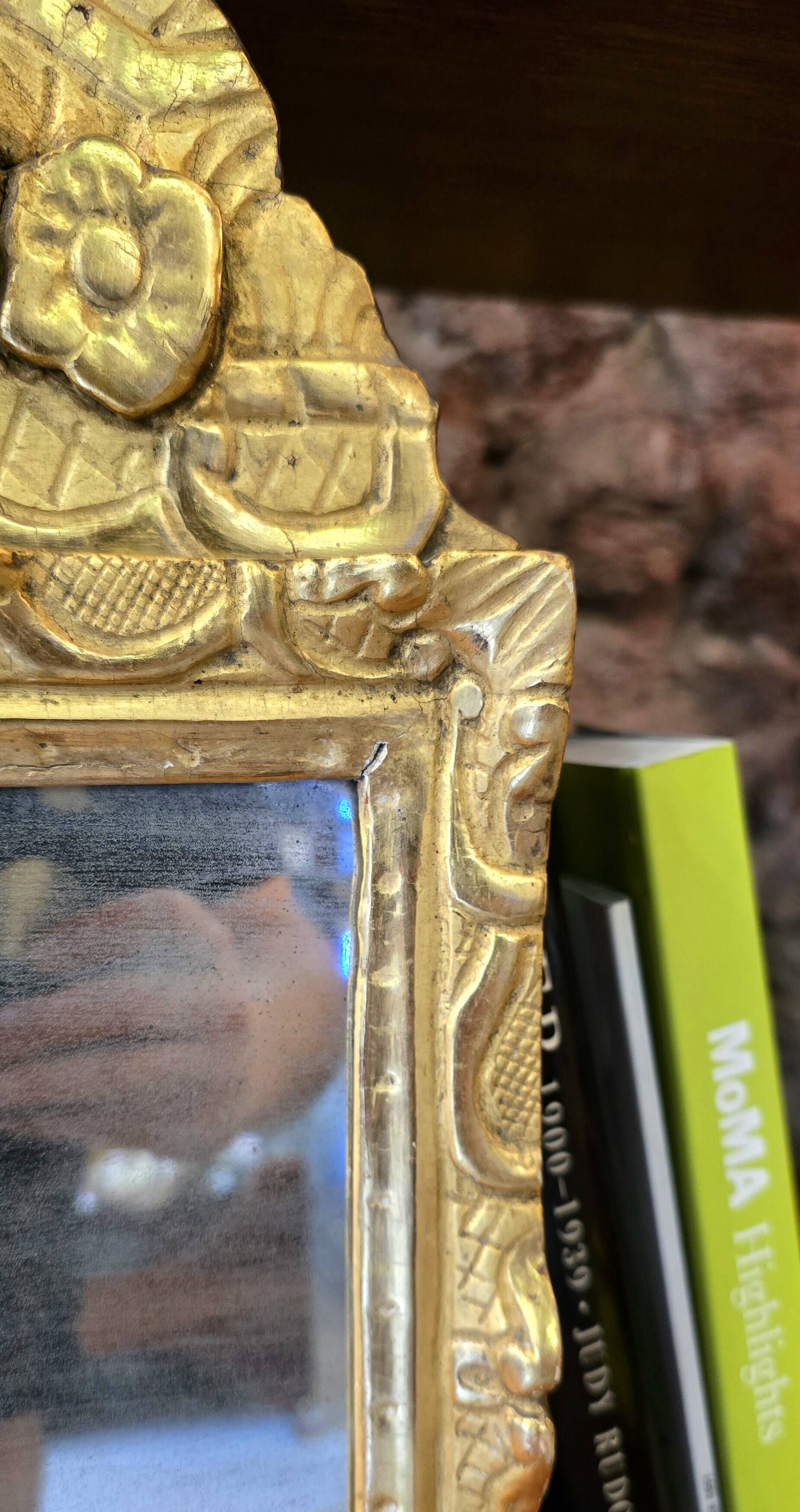 Small Louis XIV mirror in gilded carved wood from the early 18th century.