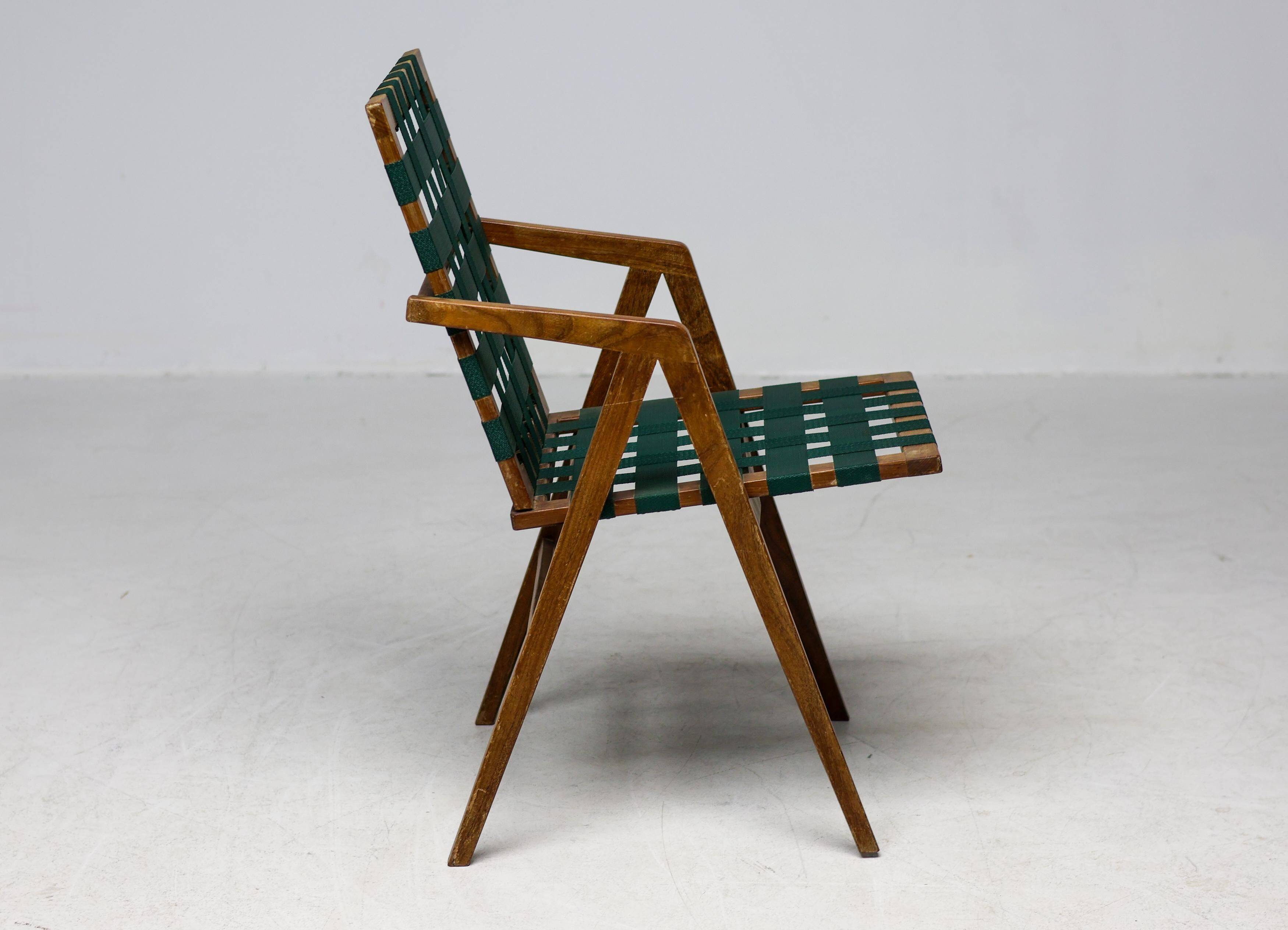 Mid-century Italian armchair in walnut with straps, in the style of Franco Albini.
