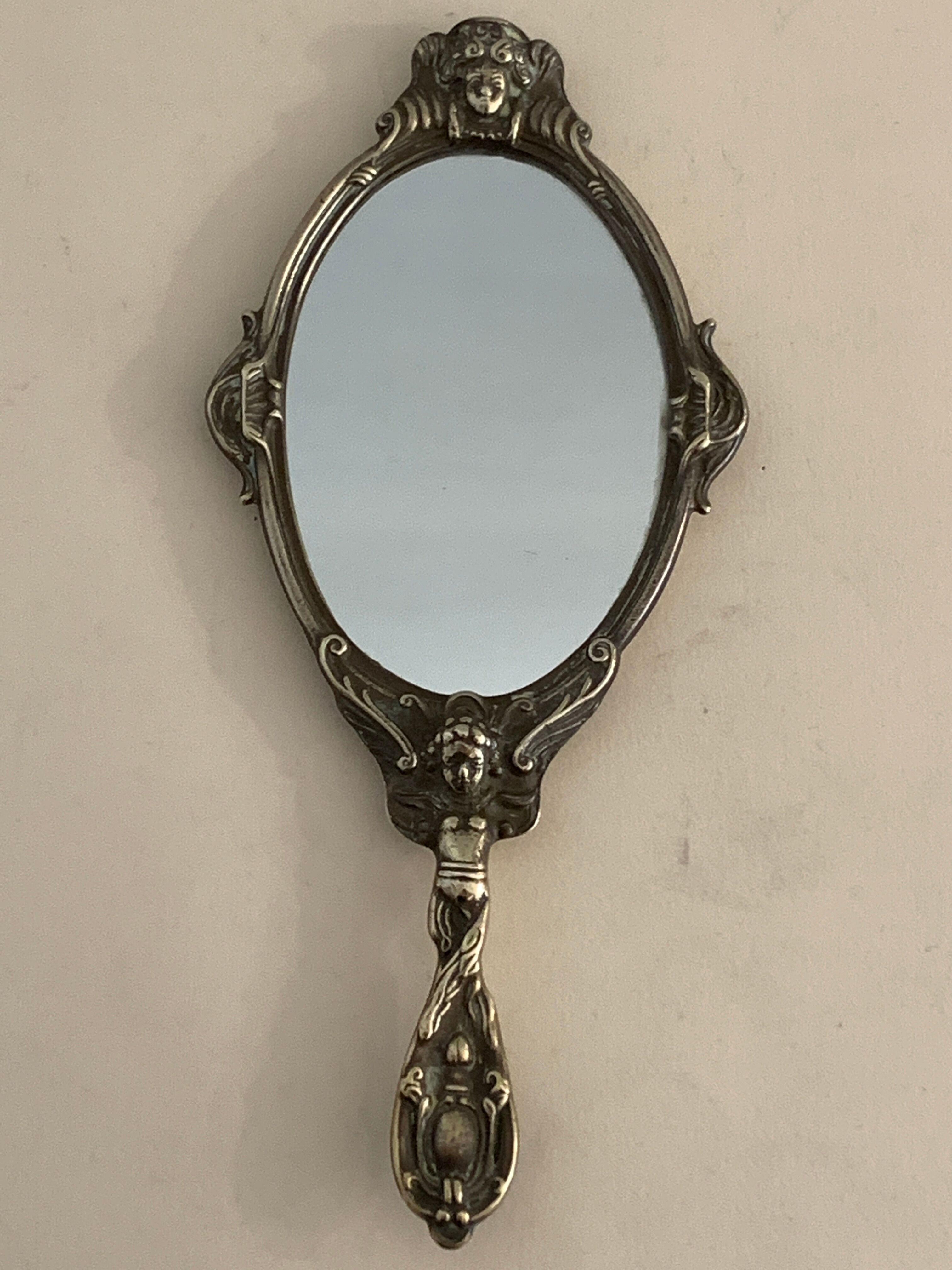 Bronze hand-facing mirror, early twentieth century, Louis XV style, 29 x 13 cm