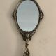 Bronze hand-facing mirror, early twentieth century, Louis XV style, 29 x 13 cm