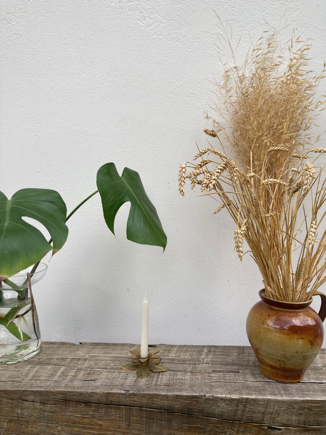 Old golden brass candle holder in the shape of a leaf or flower