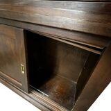 Vintage wooden display cabinet with sliding doors.