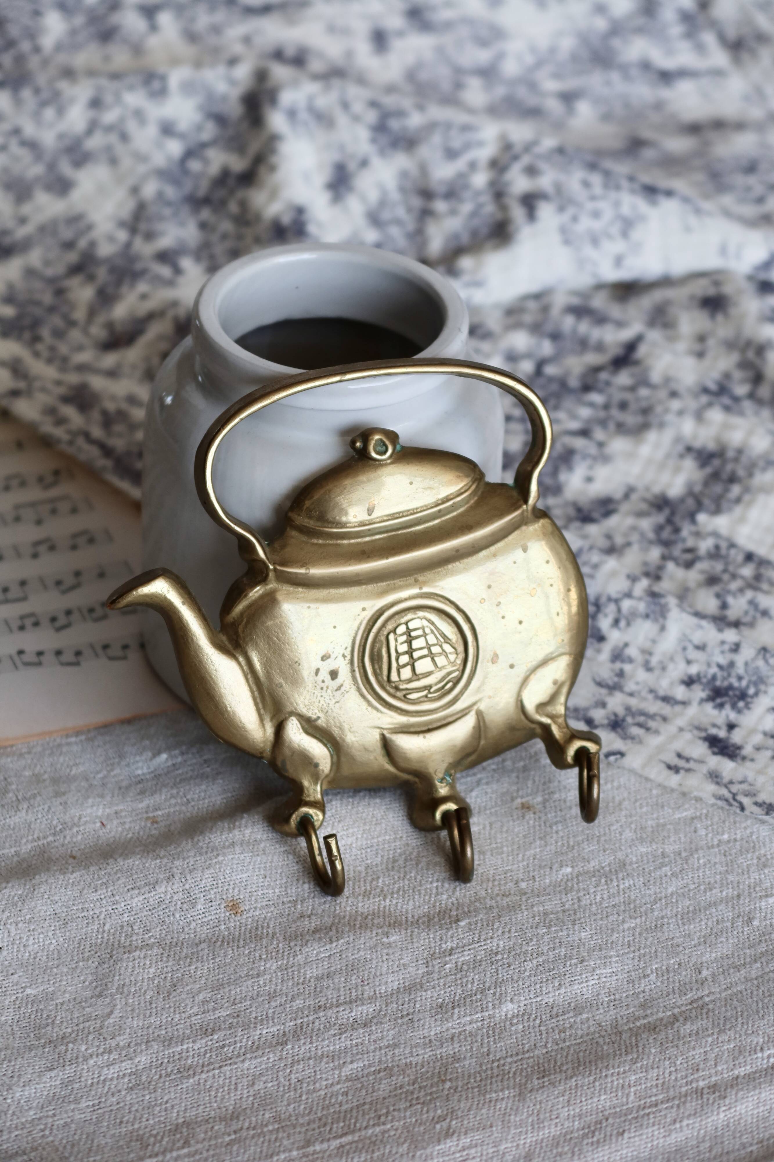 Vintage teapot-shaped brass coat hook
