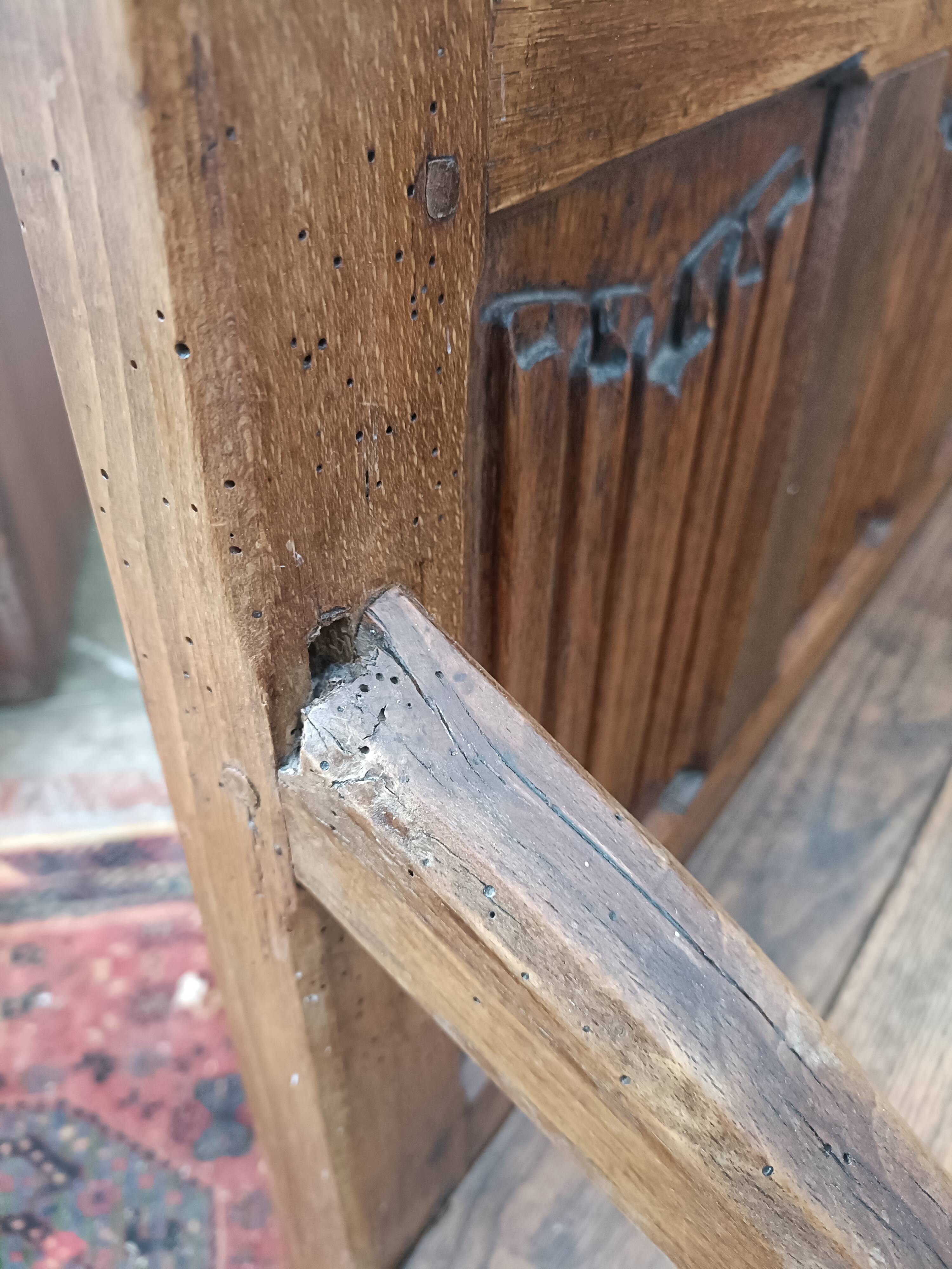Oak church bench period XVII th century, back decorated with carved parchments