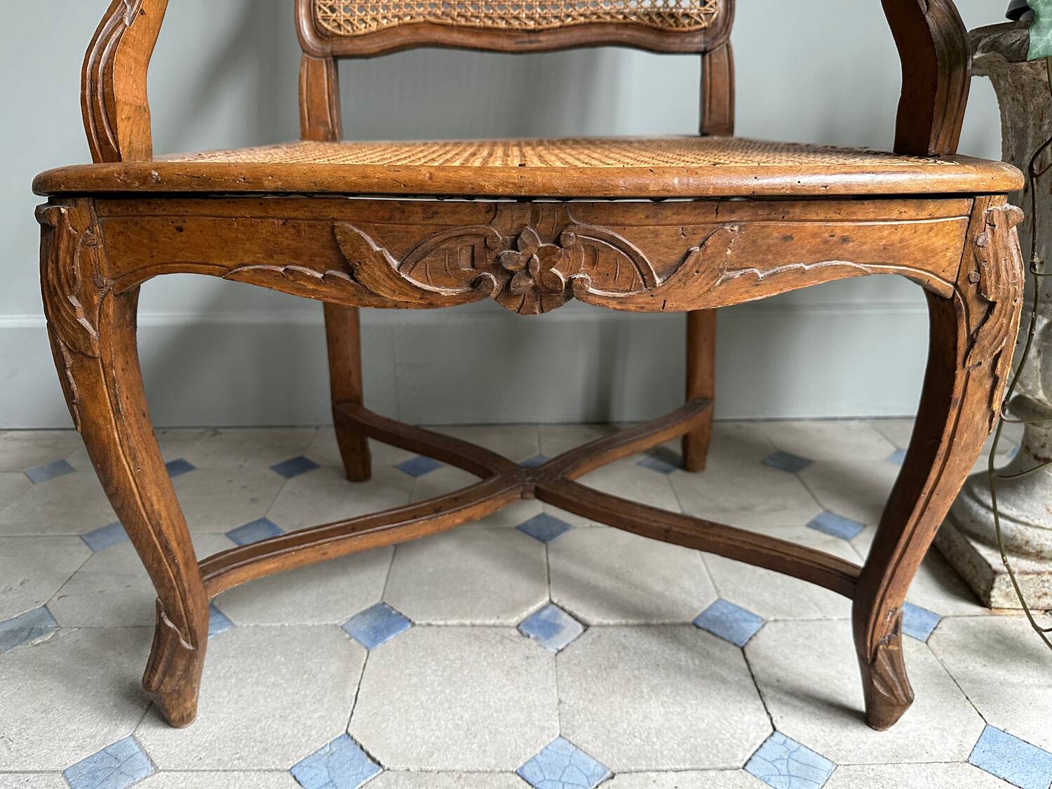 Regency armchair with stretcher