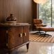 Small vintage 1950s wooden buffet with marble top and tapered legs.