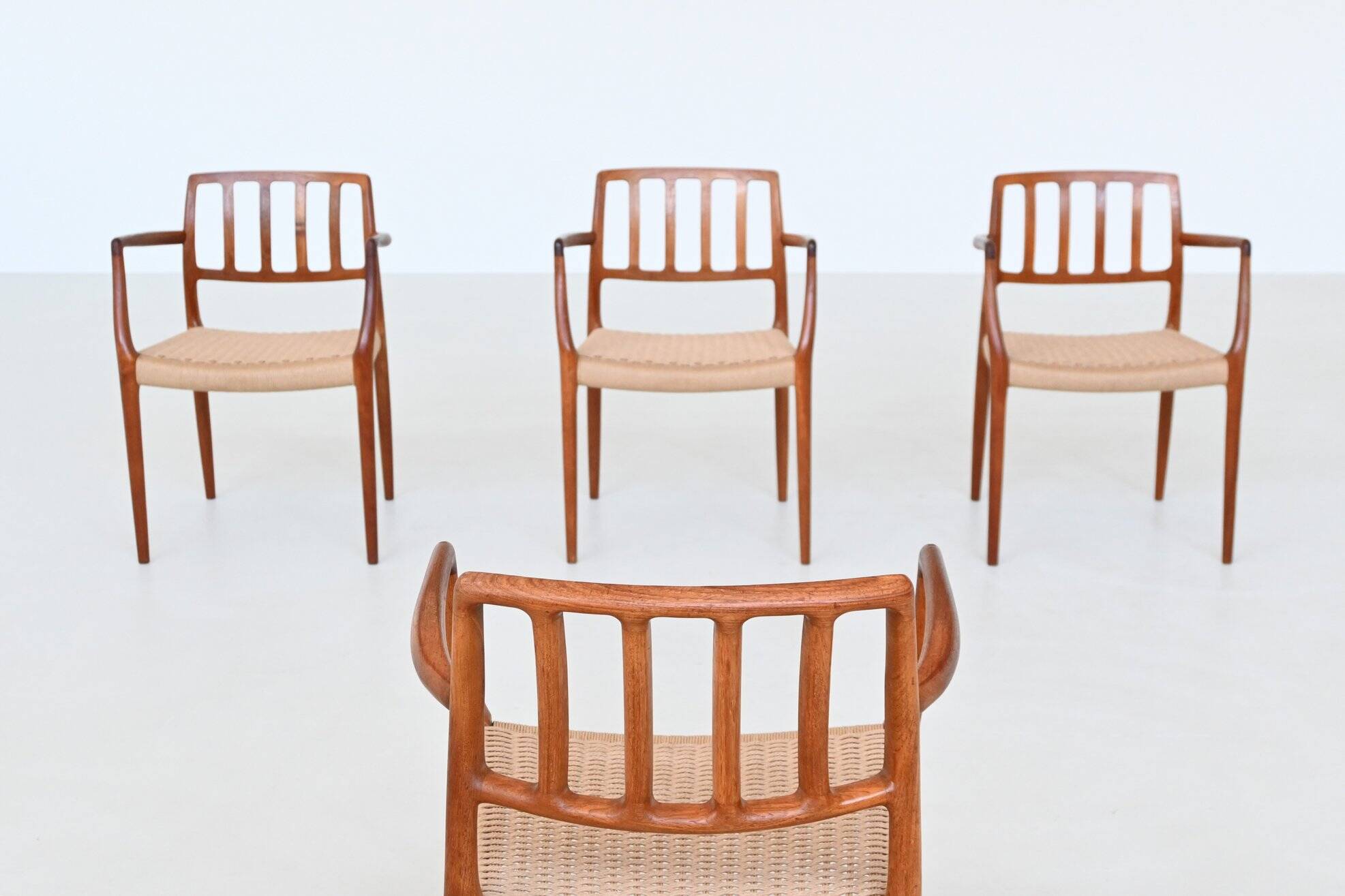Niels Otto Moller model 66 armchairs teak and paper cord Denmark 1974