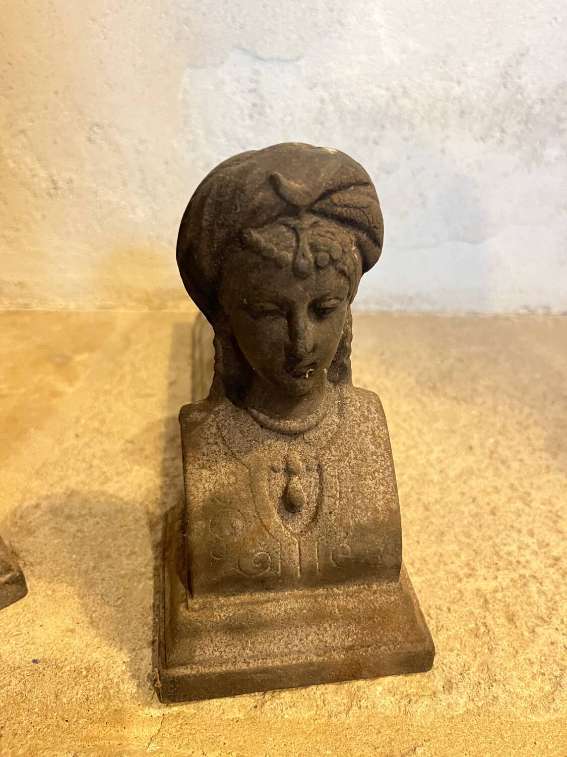 Pair of cast iron andirons with face