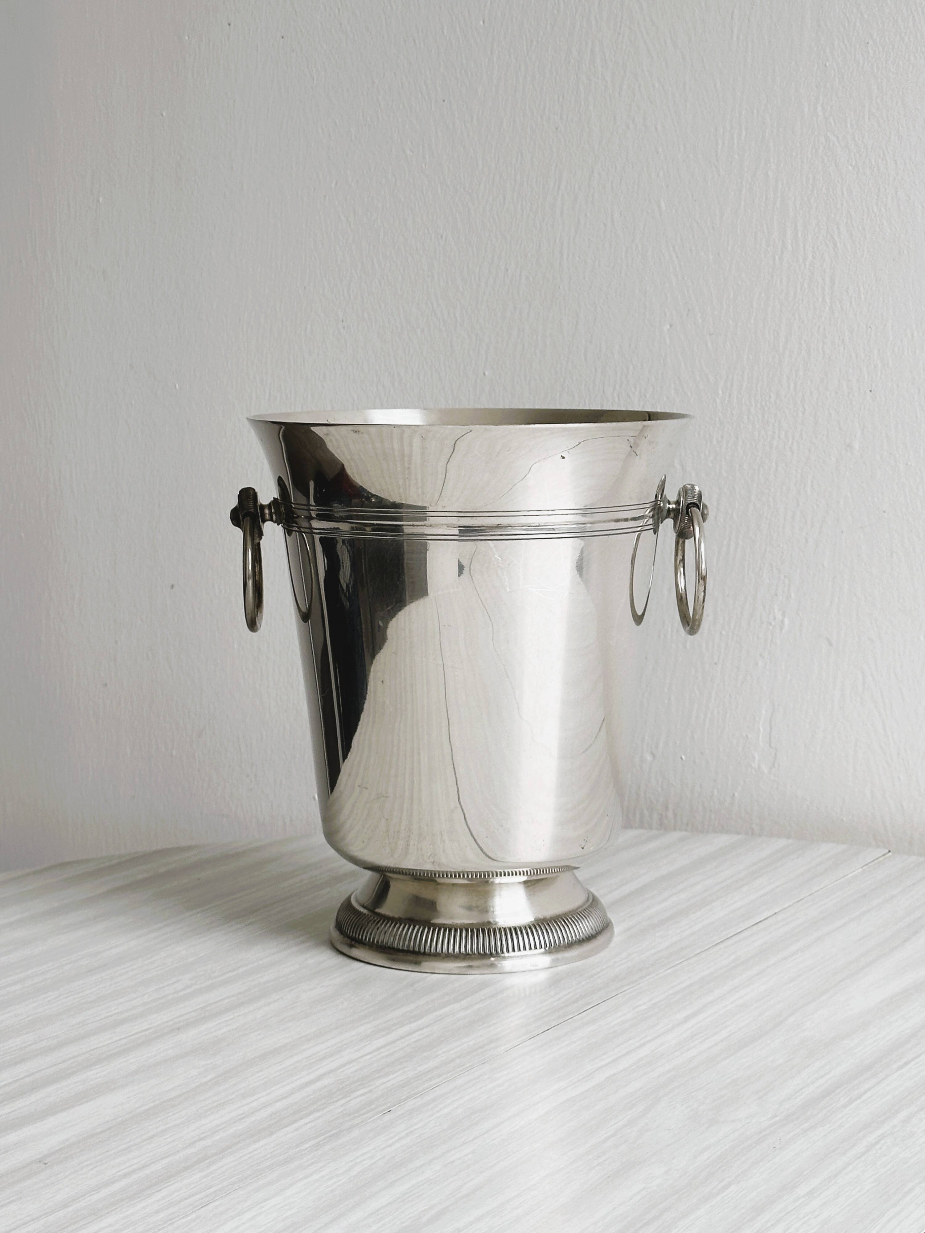 Antique champagne bucket in shiny silver metal