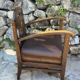 Pair of armchairs in stained wood and leather, 20th century