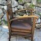 Pair of armchairs in stained wood and leather, 20th century