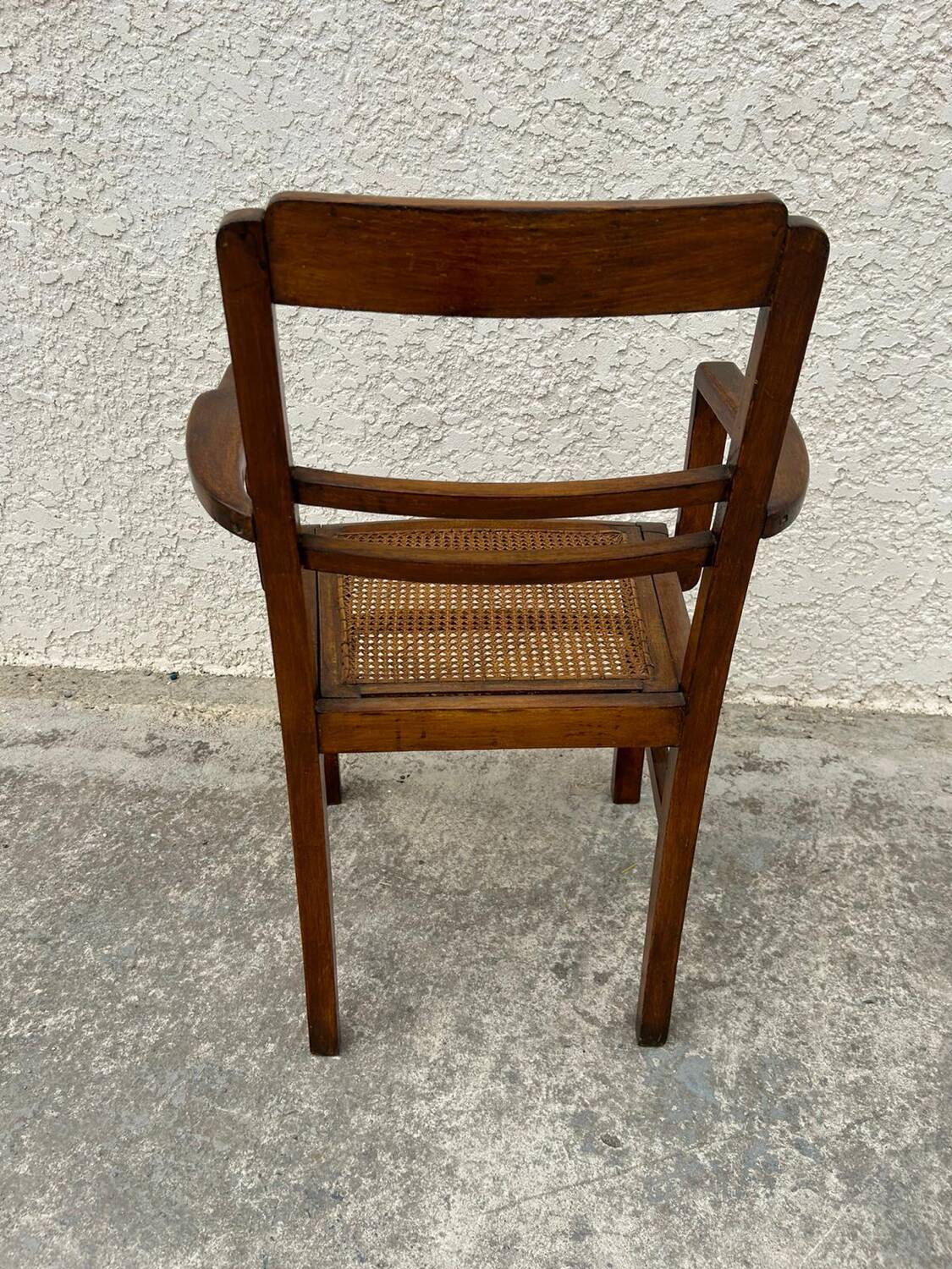 Cane armchair with armrests