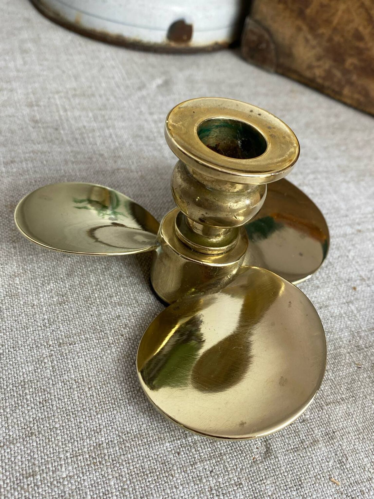 Pair of vintage brass propeller-shaped candlesticks
