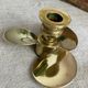 Pair of vintage brass propeller-shaped candlesticks
