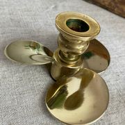 Pair of vintage brass propeller-shaped candlesticks