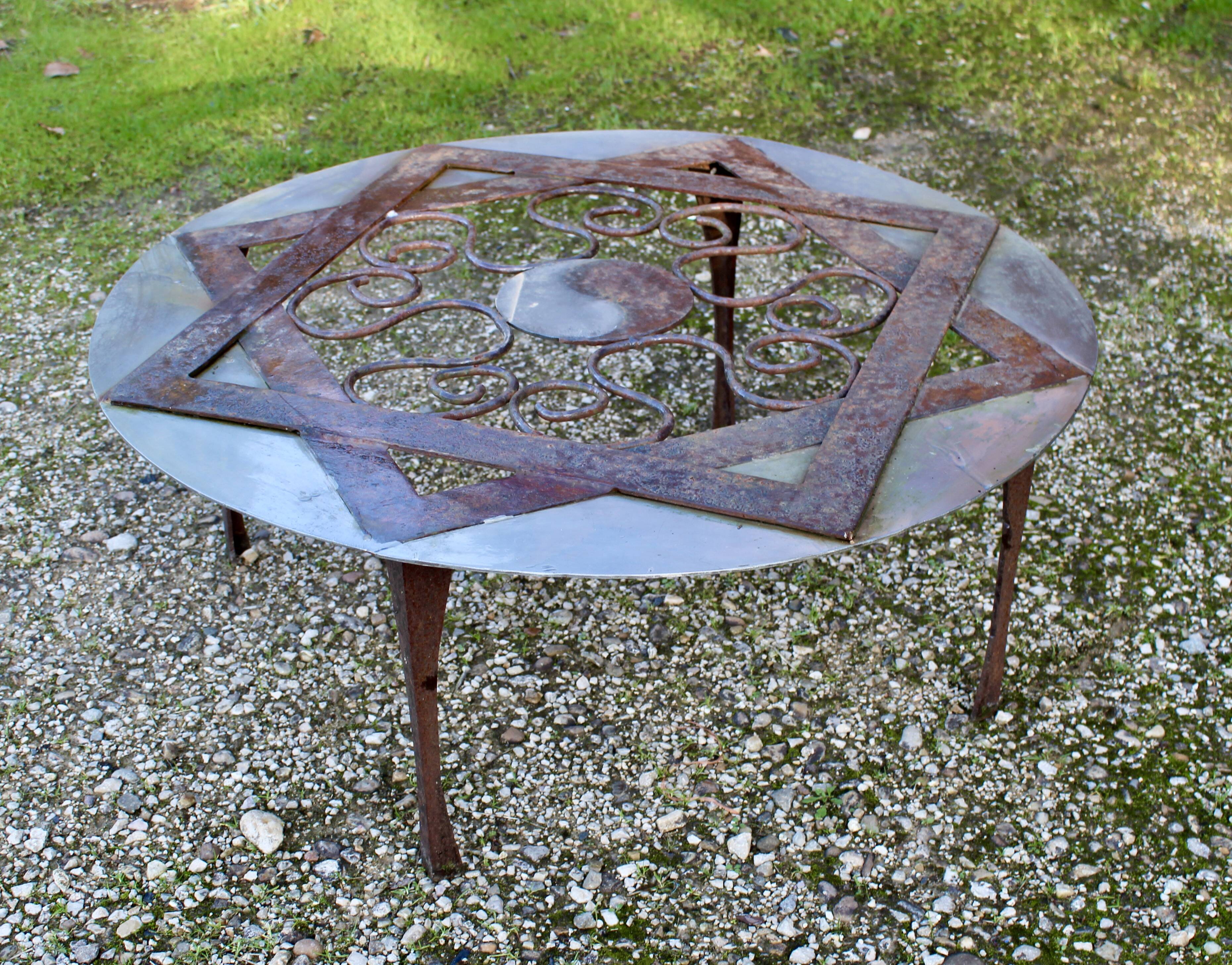 Outdoor iron table with yin yang decoration